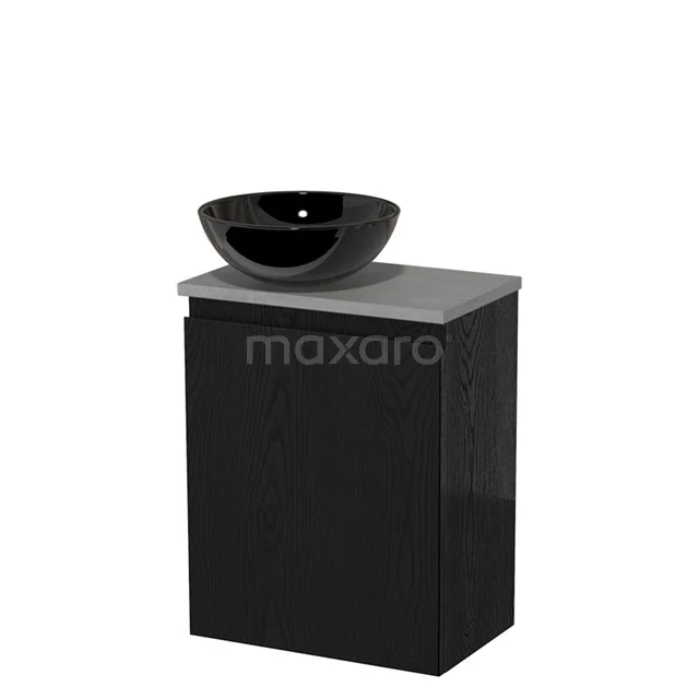 Zwarte badkamerkast met matgrijze wastafelblad en keramische zwarte komvormige wasbak, modern en compact ontwerp.