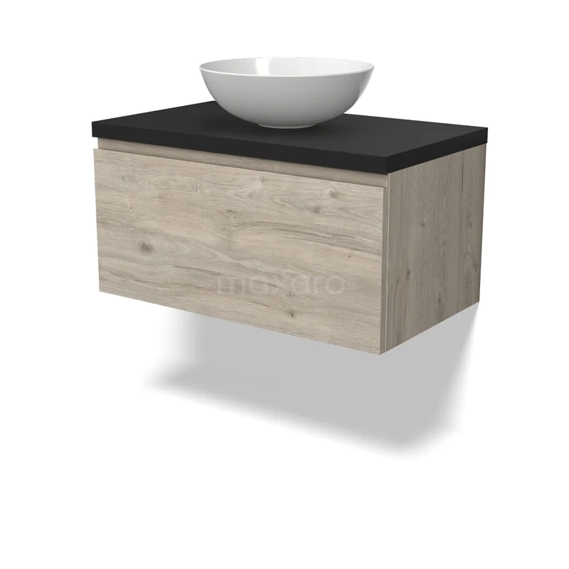 Houten badkamermeubel met hangend design, zwarte wastafelblad en witte ronde kom; stijlvol en compact voor moderne badkamers.