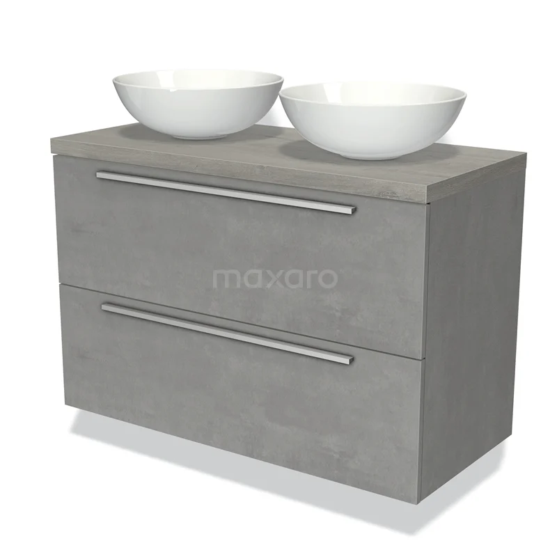 Grijs betonnen badkamermeubel met dubbele witte waskommen, strak design en chromen handgrepen, ideaal voor moderne badkamers.