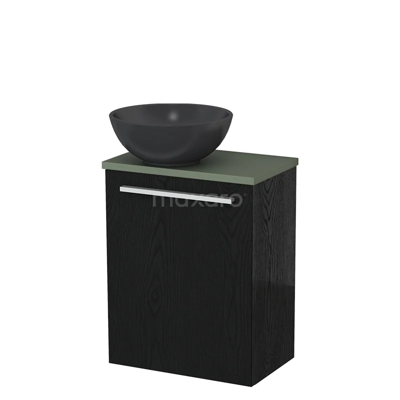 Zwart badkamermeubel met groen blad en keramische waskom, modern design, ideaal voor een stijlvolle badkamerinrichting.